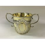 A rare Queen Anne silver gilt porringer with half