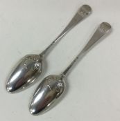 A pair of Georgian silver shell back spoons. Est.