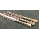 A set of three silver handled knives with steel bl