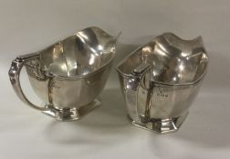 A pair of Harrod's silver sauceboats. Signed to ba