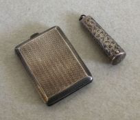 An engine turned silver match case together with a