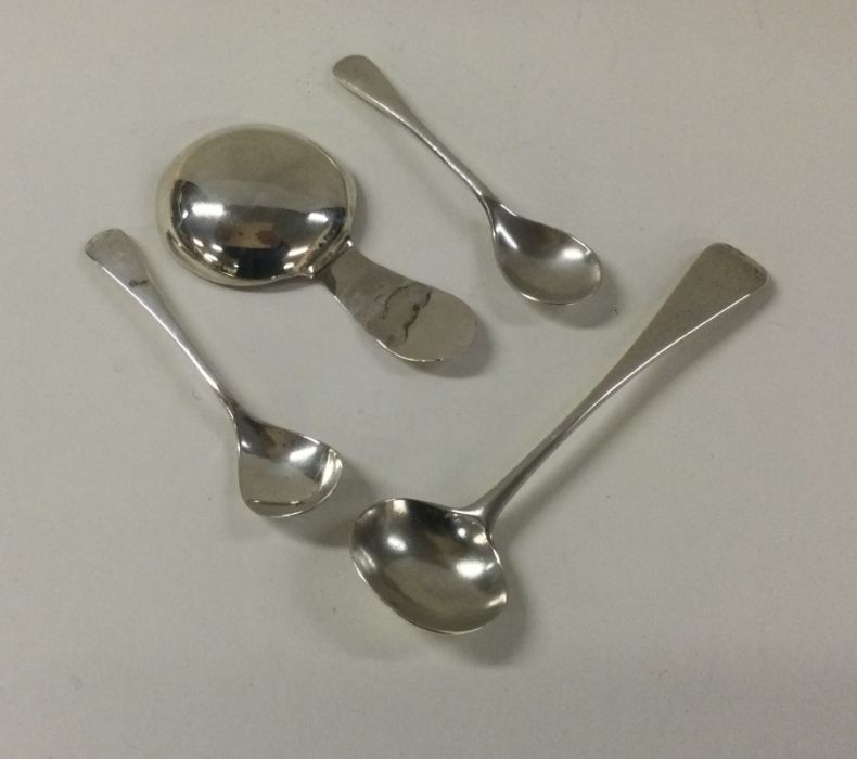 A Georgian silver caddy spoon together with other