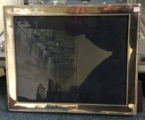 A large modern silver picture frame. Est. £40 - £6