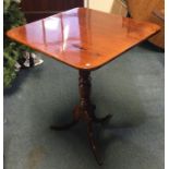 A Victorian pedestal table on three sweeping suppo