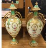 An attractive pair of gilt Royal Crown Derby ewers d