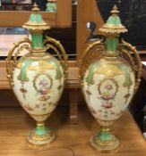 An attractive pair of gilt Royal Crown Derby ewers d