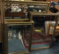 Three large rectangular wall mirrors.