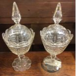 A good pair of cut glass vases and covers.