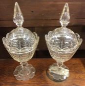 A good pair of cut glass vases and covers.