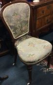 A Victorian mahogany high back chair with upholste