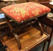 A Georgian style stool on reeded supports.