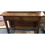 A good oak two drawer rustic polished side table.