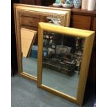 Two gilt framed mirrors.