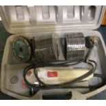 An old electric angle grinder in box.