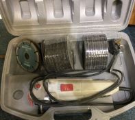 An old electric angle grinder in box.