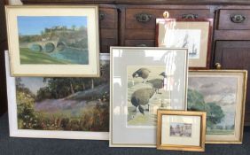 A large collection of framed and glazed pictures.