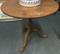 A Victorian mahogany tripod table.