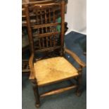 A Georgian oak stick back chair.