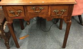 A good Georgian mahogany three drawer lowboy.