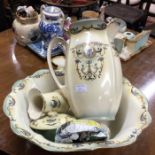 A decorative pottery jug and basin set.