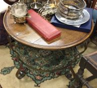 An oak and wrought iron occasional table.