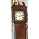 An oak cased grandfather clock with painted dial.
