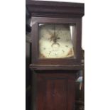 An Antique grandfather clock with painted dial.