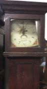 An Antique grandfather clock with painted dial.