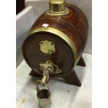 An oak and brass spirit barrel.