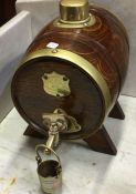 An oak and brass spirit barrel.