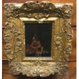 A gilt framed oil on panel depicting a gentleman.