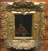 A gilt framed oil on panel depicting a gentleman.