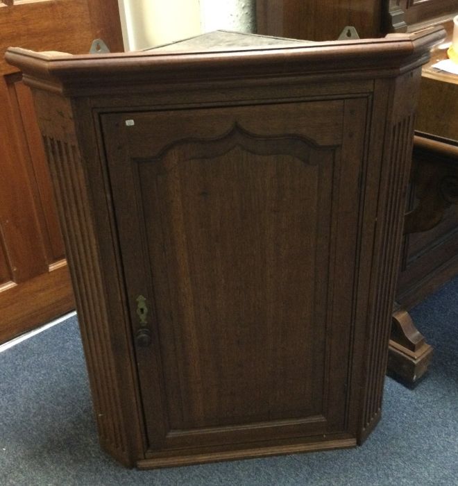 A good Georgian oak corner cupboard.