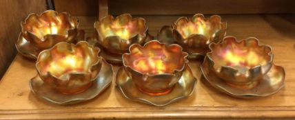 Louis Comfort Tiffany: A set of six carnival glass dishes.