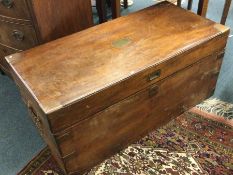 An old hinged top brass mounted trunk.