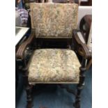 An oak carver chair with tapestry seat.