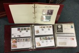 Three folios of first day covers.