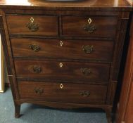 A small mahogany chest of five drawers with ivory