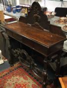 A Continental oak carved side table.