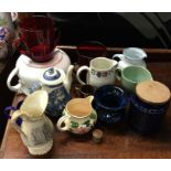 A collection of pottery and other jugs and vases.
