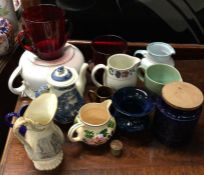 A collection of pottery and other jugs and vases.