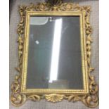 A gilt framed dressing table mirror.