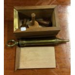 An old brass medical syringe etc.