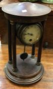 An Edwardian mahogany wall clock.