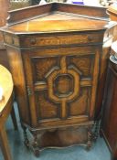 An oak barley twist mounted corner cabinet.