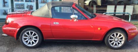 A Mazda MX-5 Roadster Enous Manual convertible car