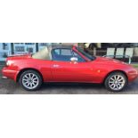 A Mazda MX-5 Roadster Enous Manual convertible car