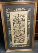 A gilt framed silk sampler.