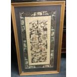 A gilt framed silk sampler.