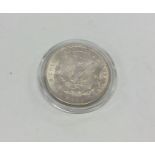 A silver 1oz American dollar. Approx. 30 grams. Es
